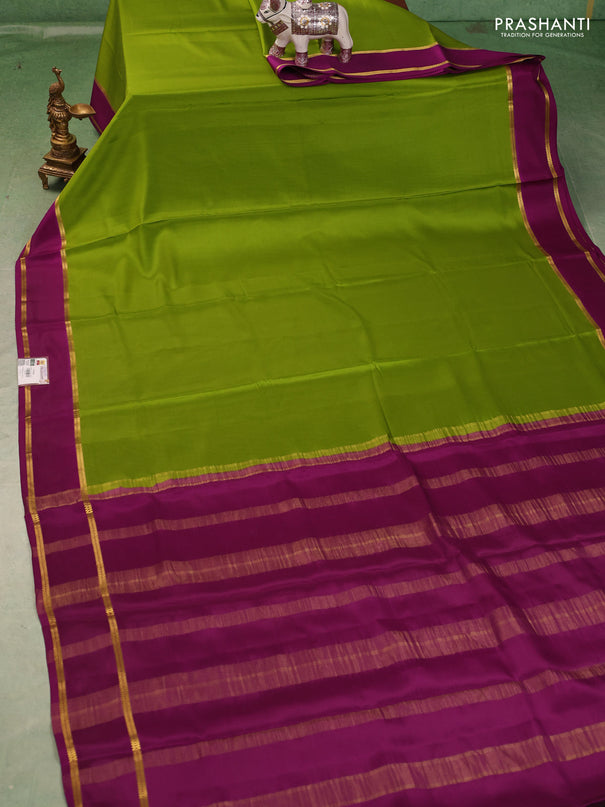 Pure mysore silk saree light green and purple with plain body and rettapet zari woven buttas