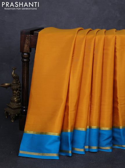 Pure mysore silk saree mustard yellow and blue with plain body and rettapet zari woven buttas