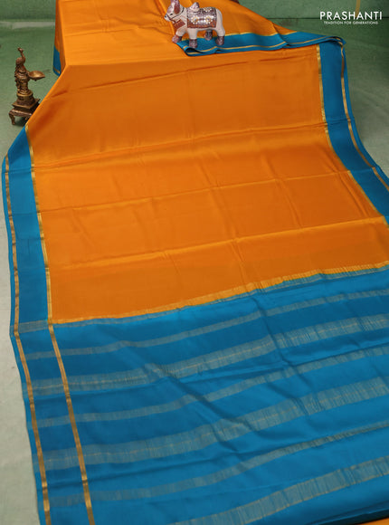 Pure mysore silk saree mustard yellow and blue with plain body and rettapet zari woven buttas