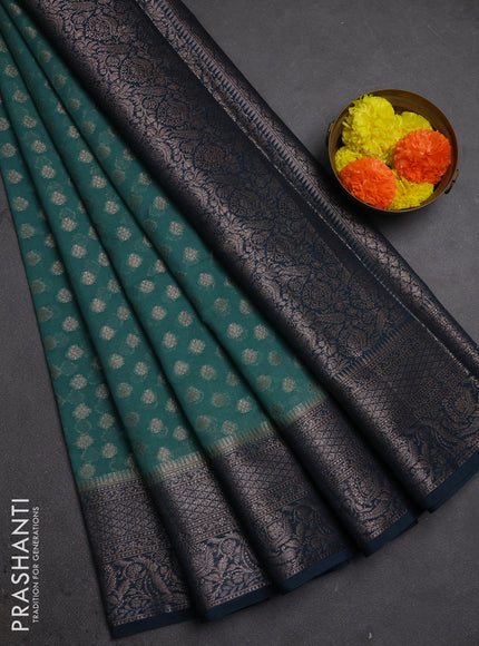 Semi chiniya silk saree teal green shade and peacock green with allover thread & zari woven buttas and woven border