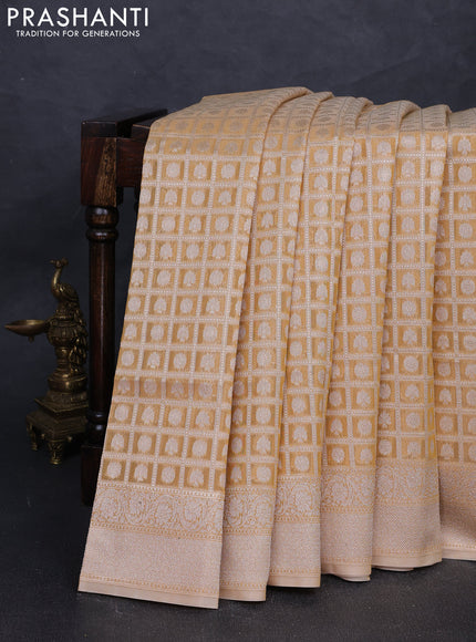 Banarasi silk cotton saree sandal with allover thread & zari checks & buttas and thread & zari woven border