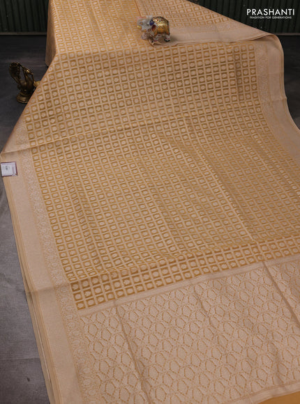 Banarasi silk cotton saree sandal with allover thread & zari checks & buttas and thread & zari woven border
