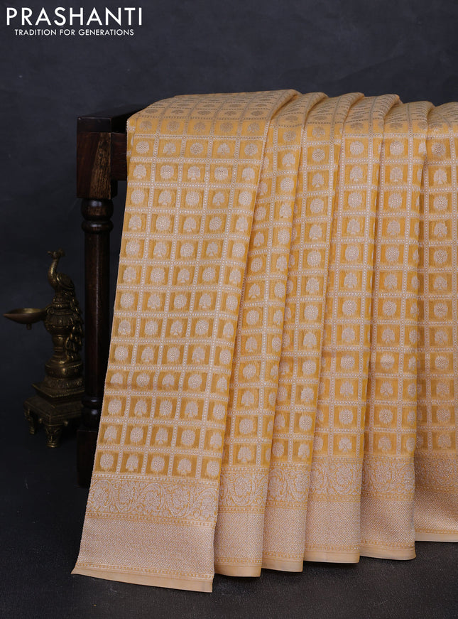 Banarasi silk cotton saree pale yellow with allover thread & zari checks & buttas and thread & zari woven border