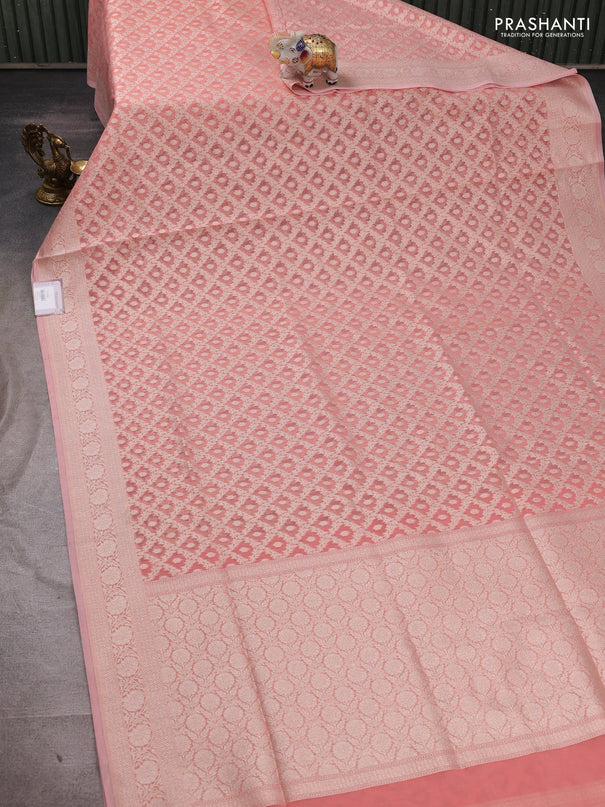 Banarasi silk cotton saree peach shade with allover thread & zari woven brocade weaves and thread & zari woven border