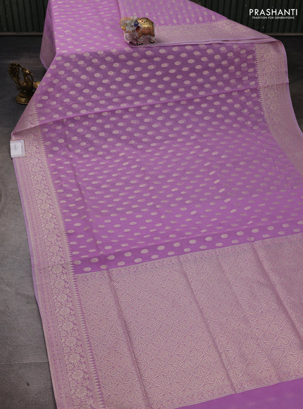 Banarasi silk cotton saree mild lavender with allover thread & zari woven buttas and thread & zari woven border