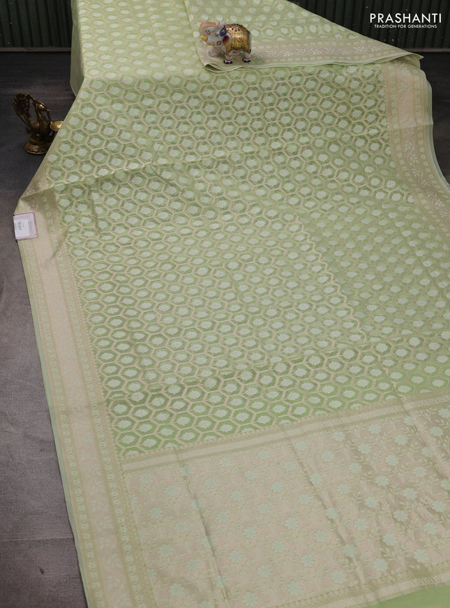 Banarasi silk cotton saree mild pista green with allover thread & zari woven brocade weaves and thread & zari woven border