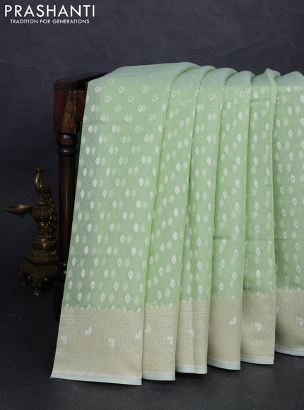 Banarasi silk cotton saree mild pista green with allover thread & zari woven buttas and thread & zari woven border
