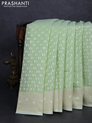 Banarasi silk cotton saree mild pista green with allover thread & zari woven buttas and thread & zari woven border