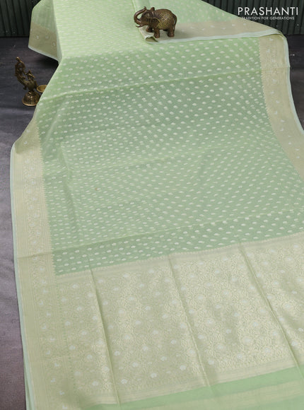 Banarasi silk cotton saree mild pista green with allover thread & zari woven buttas and thread & zari woven border