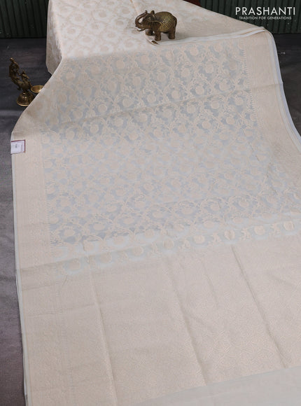 Banarasi silk cotton saree off white with allover thread & zari woven brocade weaves and temple design thread & zari woven border
