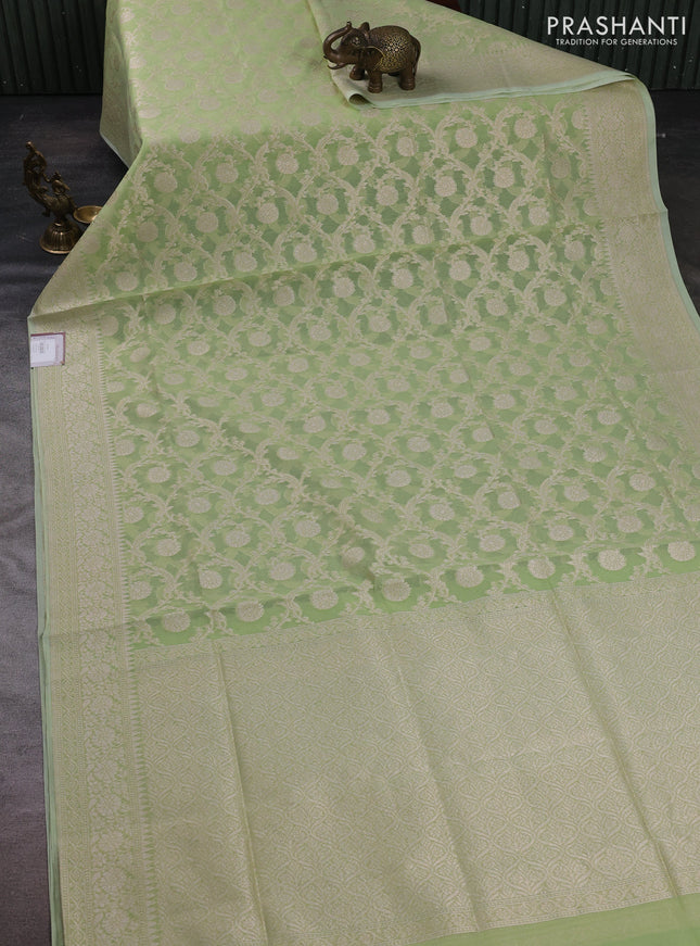 Banarasi silk cotton saree pista green with allover thread & zari woven brocade weaves and temple design thread & zari woven border