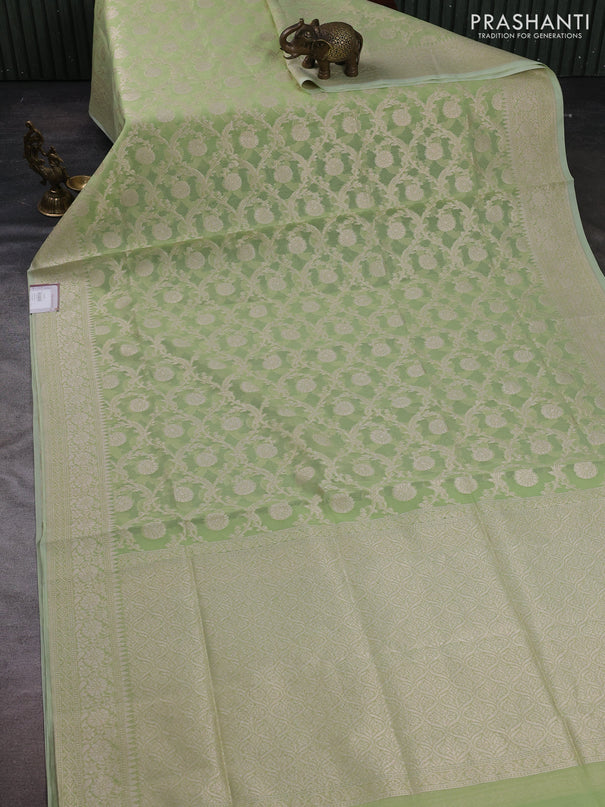 Banarasi silk cotton saree pista green with allover thread & zari woven brocade weaves and temple design thread & zari woven border