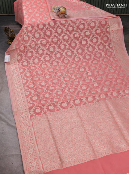 Banarasi silk cotton saree peach pink with allover thread & zari woven brocade weaves and temple design thread & zari woven border