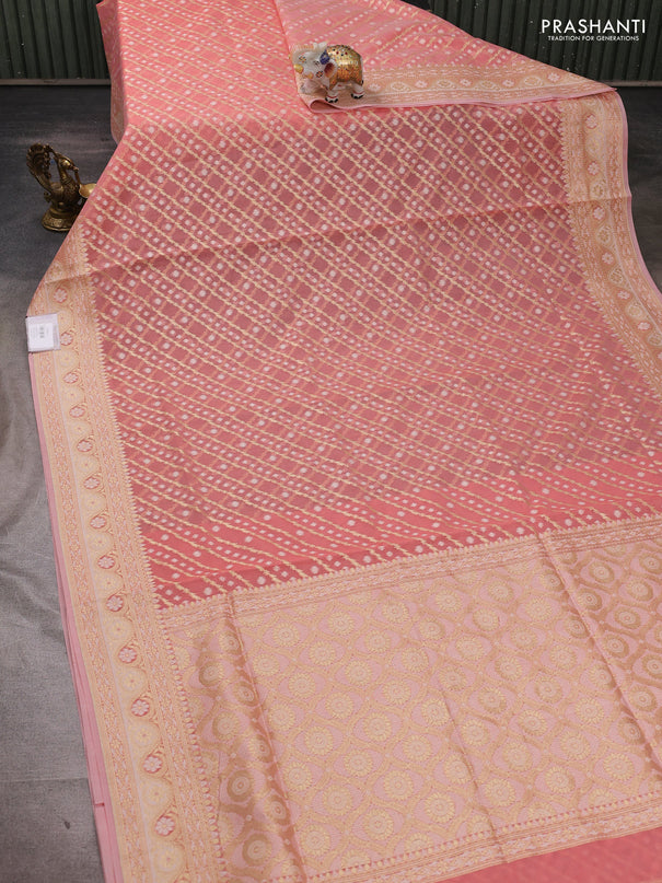Banarasi silk cotton saree peach shade with allover thread & zari woven brocade weaves and thread & zari woven border