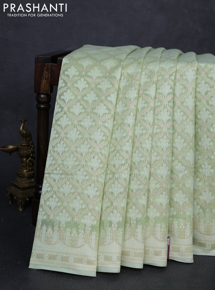 Banarasi silk cotton saree mild pista green with allover thread & zari woven brocade weaves and thread & zari woven border