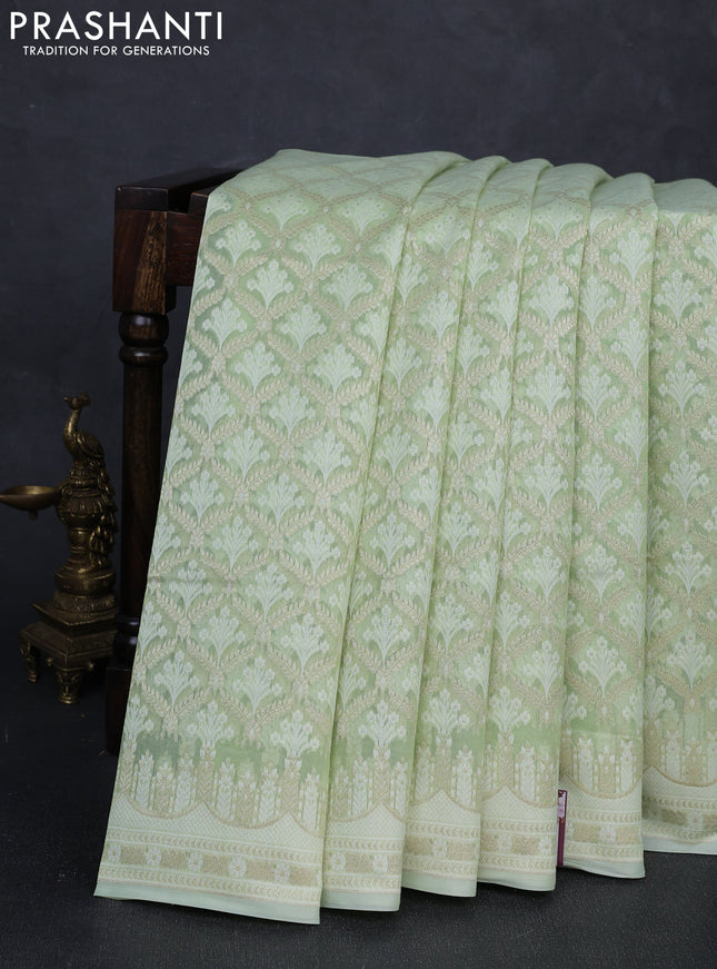 Banarasi silk cotton saree mild pista green with allover thread & zari woven brocade weaves and thread & zari woven border