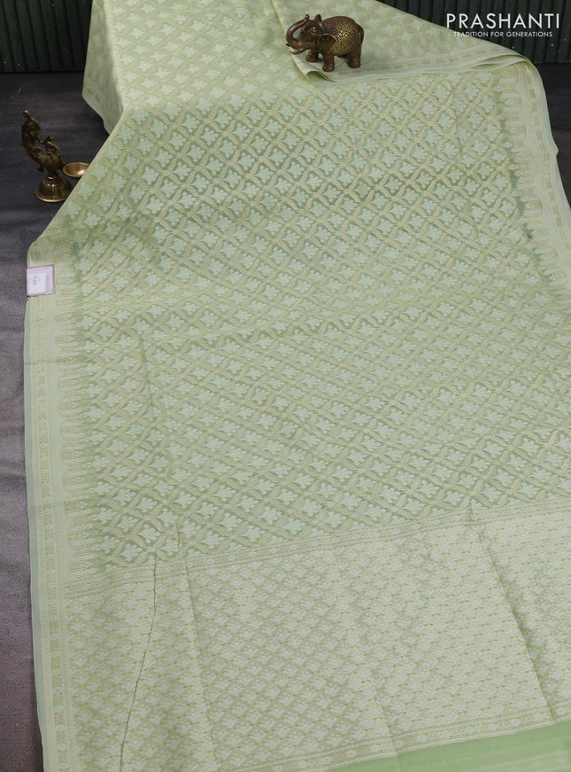 Banarasi silk cotton saree mild pista green with allover thread & zari woven brocade weaves and thread & zari woven border