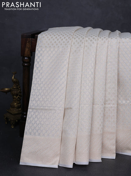Banarasi silk cotton saree off white with allover zari woven buttas and zari woven border