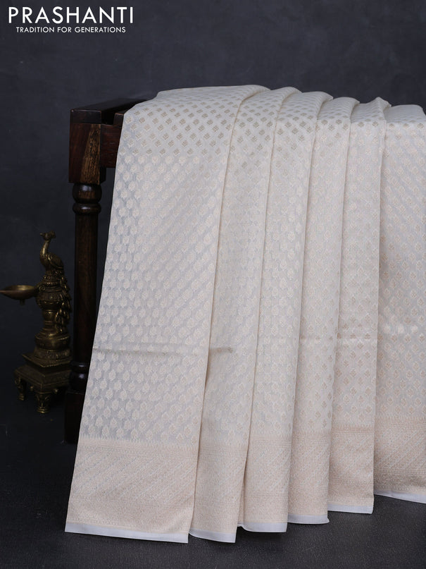 Banarasi silk cotton saree off white with allover zari woven buttas and zari woven border
