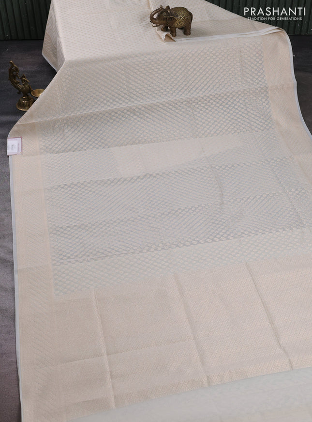 Banarasi silk cotton saree off white with allover zari woven buttas and zari woven border