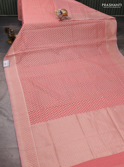 Banarasi silk cotton saree peach shade with allover zari woven buttas and zari woven border