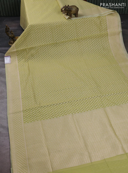 Banarasi silk cotton saree pista green with allover zari woven buttas and zari woven border