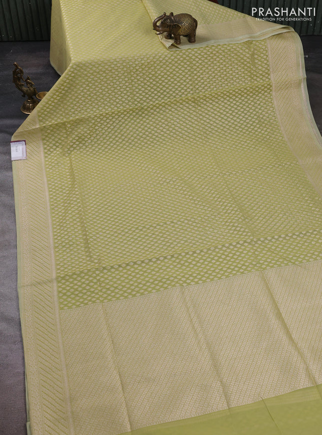 Banarasi silk cotton saree pista green with allover zari woven buttas and zari woven border