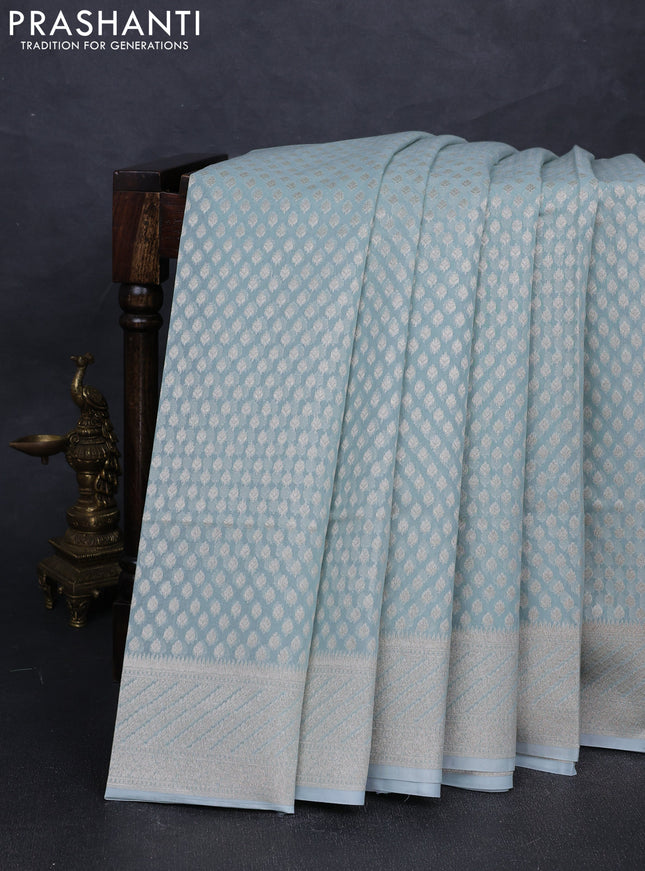 Banarasi silk cotton saree teal blue with allover zari woven buttas and zari woven border