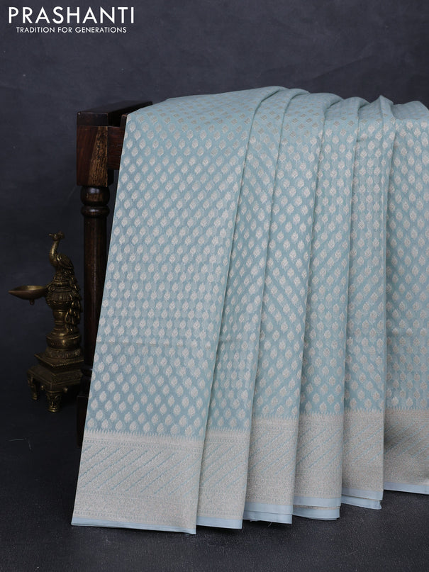 Banarasi silk cotton saree teal blue with allover zari woven buttas and zari woven border