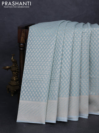 Banarasi silk cotton saree teal blue with allover zari woven buttas and zari woven border