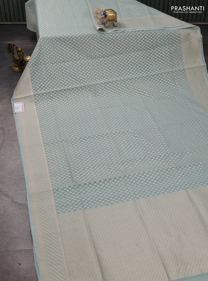 Banarasi silk cotton saree teal blue with allover zari woven buttas and zari woven border