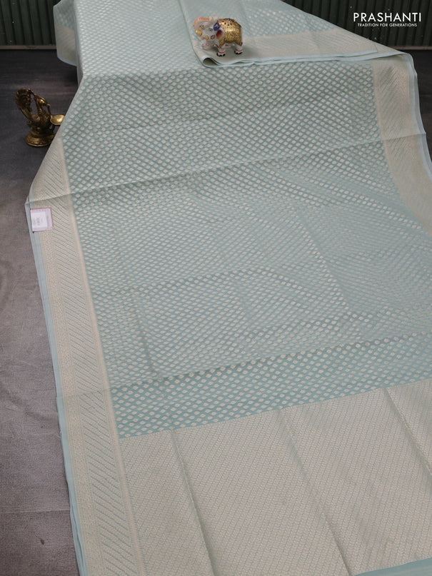 Banarasi silk cotton saree teal blue with allover zari woven buttas and zari woven border