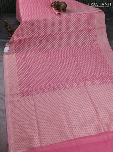 Banarasi silk cotton saree peach pink with allover zari woven buttas and zari woven border