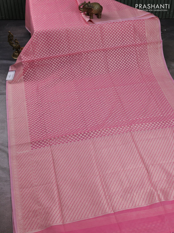Banarasi silk cotton saree peach pink with allover zari woven buttas and zari woven border