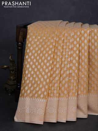 Banarasi silk cotton saree pale yellow with allover thread & zari woven buttas and thread & zari woven border