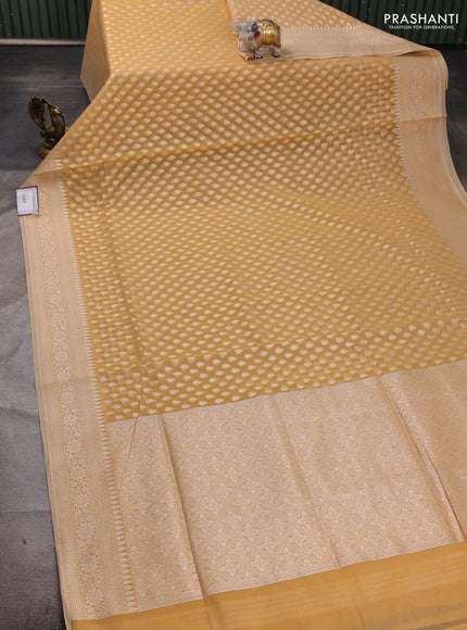 Banarasi silk cotton saree pale yellow with allover thread & zari woven buttas and thread & zari woven border