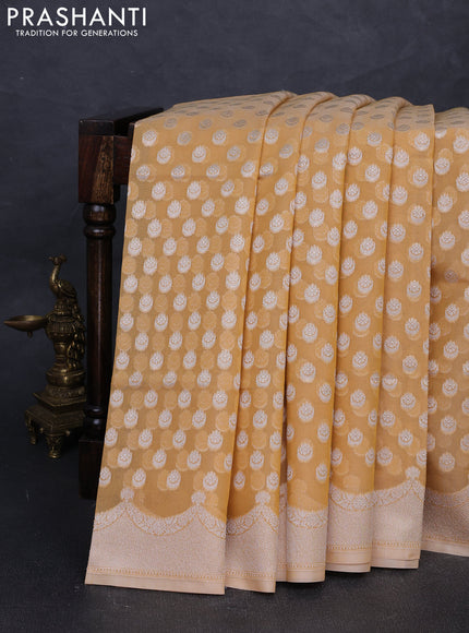 Banarasi silk cotton saree pale yellow with allover thread & zari woven buttas and thread & zari woven border