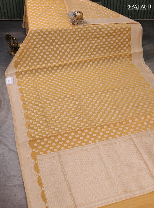 Banarasi silk cotton saree pale yellow with allover thread & zari woven buttas and thread & zari woven border