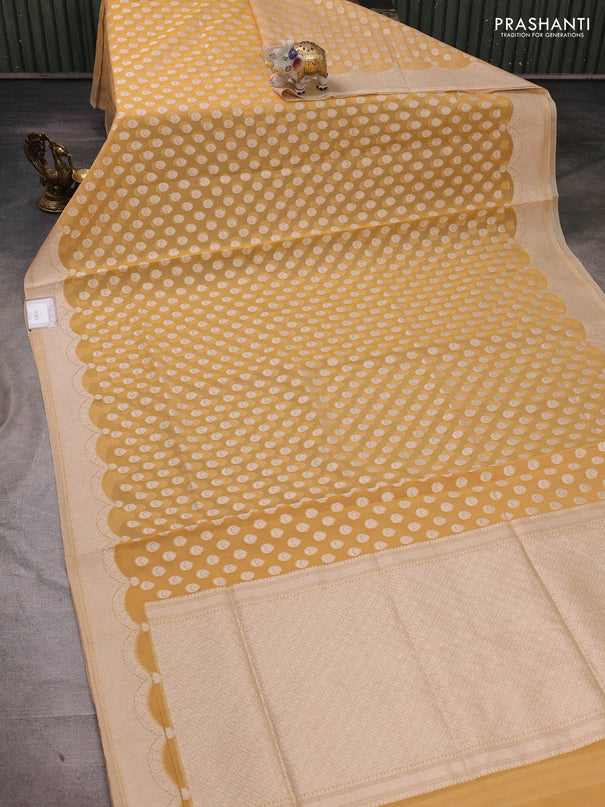 Banarasi silk cotton saree pale yellow with allover thread & zari woven buttas and thread & zari woven border