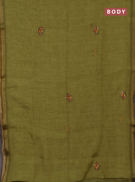 Tissue linen saree light green with embroidery buttas and embroidery pallu