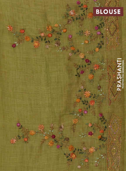 Tissue linen saree light green with embroidery buttas and embroidery pallu