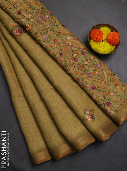 Tissue linen saree mustard green with embroidery buttas and embroidery pallu