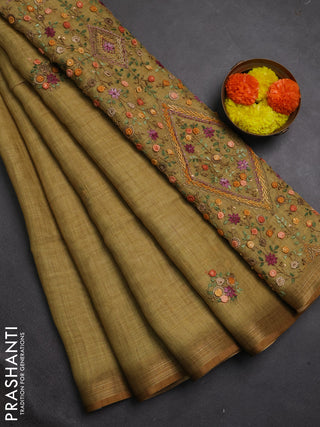 Tissue linen saree mustard green with embroidery buttas and embroidery pallu