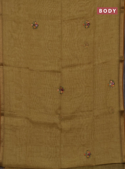 Tissue linen saree mustard green with embroidery buttas and embroidery pallu