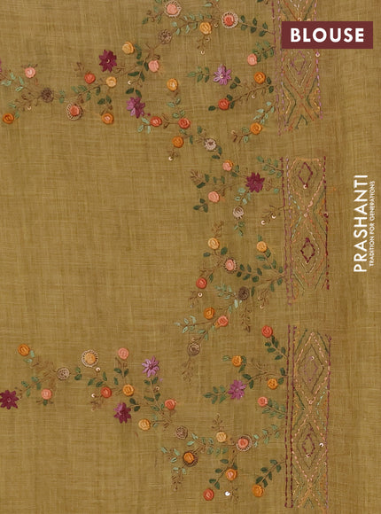 Tissue linen saree mustard green with embroidery buttas and embroidery pallu