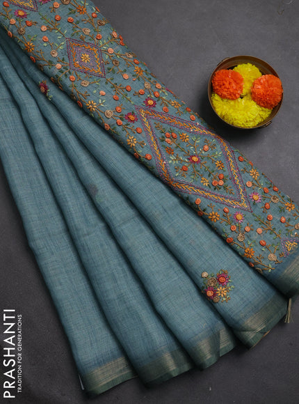 Tissue linen saree teal blue with embroidery buttas and embroidery pallu