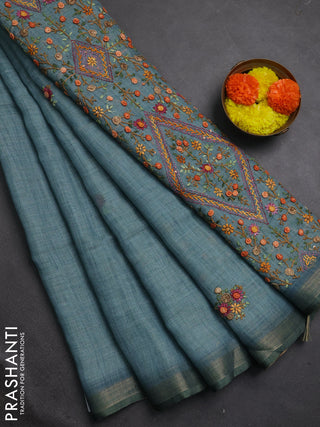 Tissue linen saree teal blue with embroidery buttas and embroidery pallu