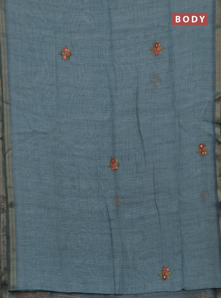 Tissue linen saree teal blue with embroidery buttas and embroidery pallu