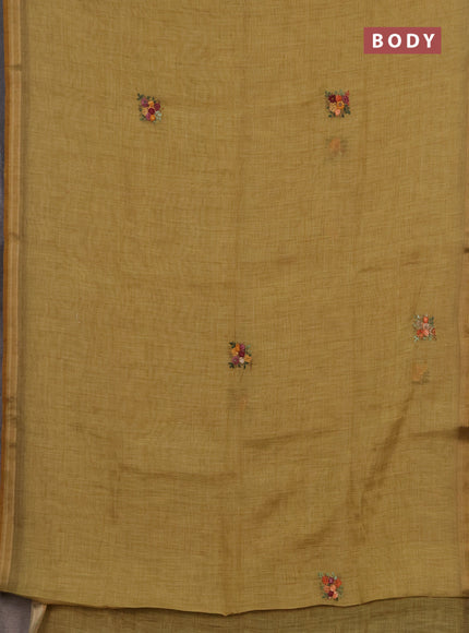 Tissue linen saree mustard yellow with embroidery buttas and embroidery pallu