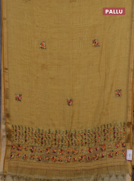 Tissue linen saree mustard yellow with embroidery buttas and embroidery pallu